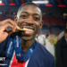 PSG players celebrate lifting the Champions League trophy