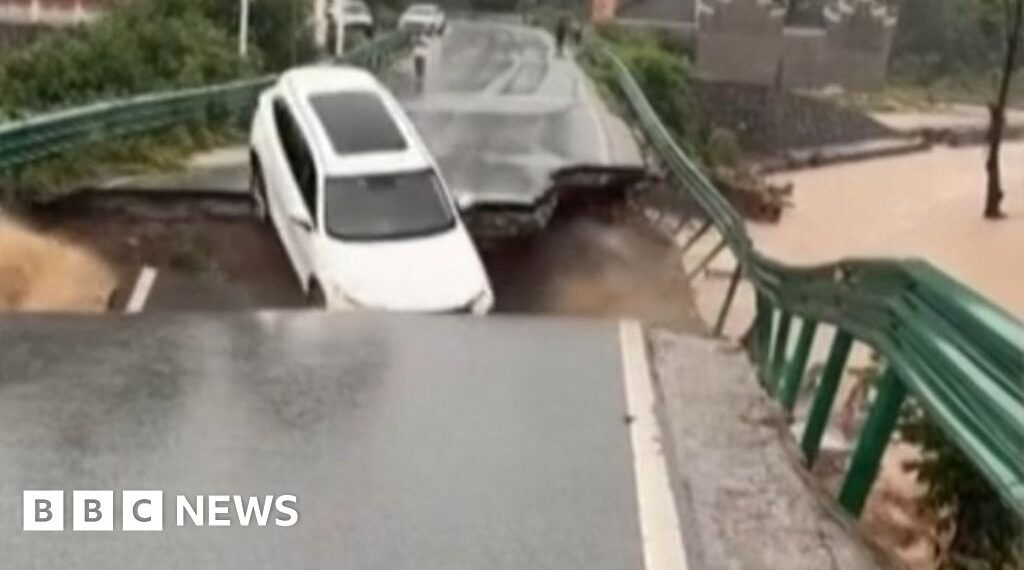 Car swept away after bridge collapse