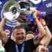 Paris St-Germain manager Luis Enrique smiling with the Champions League trophy