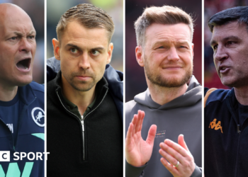 Alex Neil, wearing a navy blue Millwall jacket, with his mouth open shouting. Tonda Eckert, wearing a black jacket, looks straight-faced. Kim Hellberg, wearing a grey hoodie, claps his hands together. Sergej Jakirovic wearing a black Hull City tracksuit top.