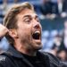 Referee Michael Salisbury signals before he awards a second goal to Matheus Cunha of Manchester United after a VAR check