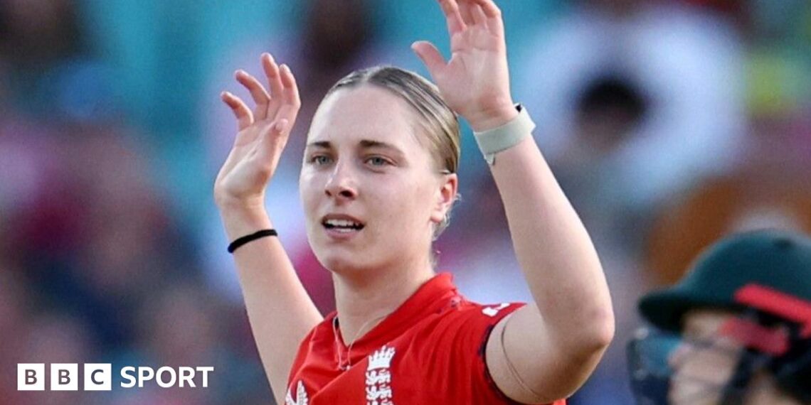 Freya Kemp holds her arms aloft