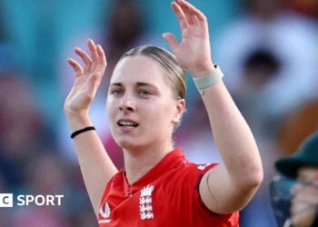 Freya Kemp holds her arms aloft