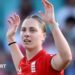 Freya Kemp holds her arms aloft
