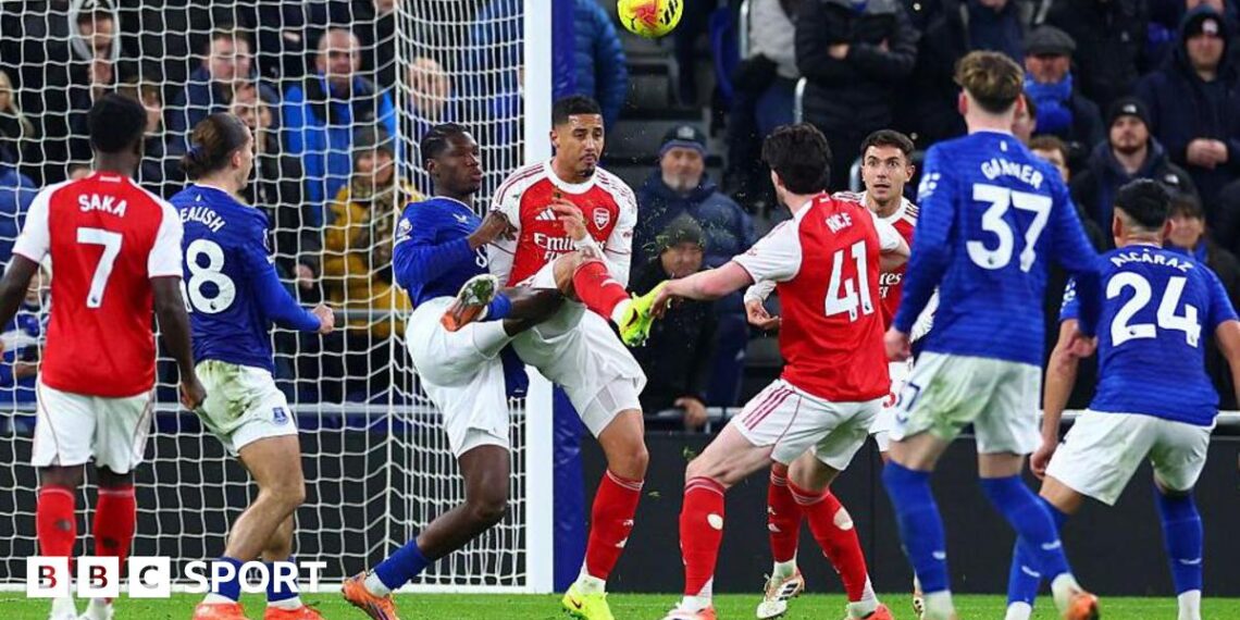 William Saliba challenges Thierno Barry for the ball