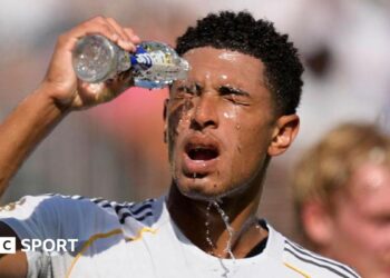 Jude Bellingham pours water over his face while playing for Real Madrid at the Club World Cup