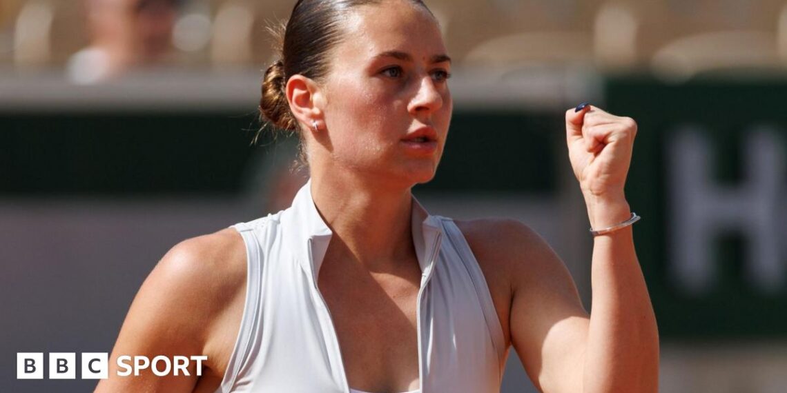 Ukraine's Marta Kostyuk clenches her first in celebration after winning her French Open first-round match