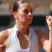 Ukraine's Marta Kostyuk clenches her first in celebration after winning her French Open first-round match