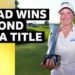 Lottie Woad smiles and holds up a silver trophy Krigor Queen's City Championship trophy in one hand, and a golf ball in her other hand