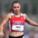 Hannah Brier runs in a red Cymru vest at the Commonwealth Games in Birmingham in 2022.
