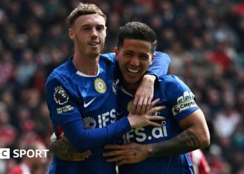 Cole Palmer celebrates Enzo Fernandez's equaliser by putting his arm around his teammate