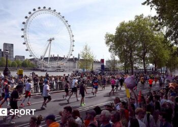 London Marathon runners with the London Eye in the background