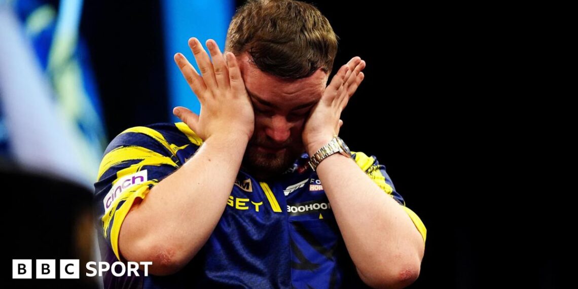 An emotional Luke Littler wipes away tears after beating Luke Humphries to win  the 2026 Premier League Darts