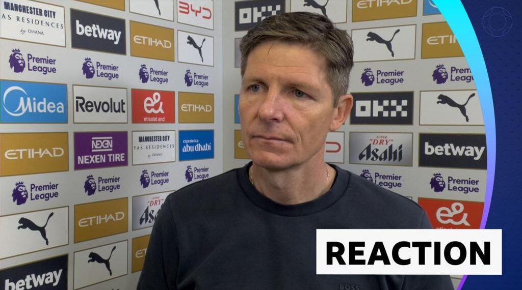 Oliver Glasner in post-match interview standing against advertising board