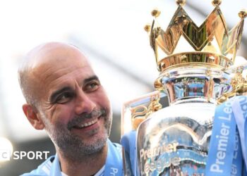 Pep Guardiola holds up six fingers to fans to indicate the six Premier League titles won after their match with Liverpool in December 2024