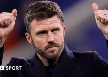 Michael Carrick acknowledges Manchester United fans following victory over Everton in February
