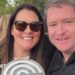 Liverpool Women manager Matt Beard and his wife Debbie smile while celebrating the Reds' Championship title win