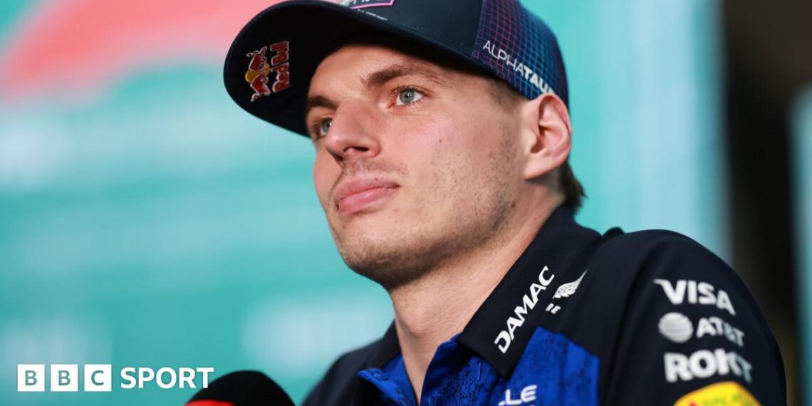 Red Bull's Max Verstappen speaking into an F1-branded microphone at the Miami Grand Prix