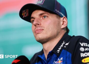 Red Bull's Max Verstappen speaking into an F1-branded microphone at the Miami Grand Prix