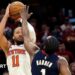 The New York Knicks' Jalen Brunson shoots the ball as he is challenged by the Cleveland Cavaliers' James Harden