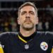 Aaron Rodgers looks on during the national anthem before his Pittsburgh Steelers team loses to the Houston Texans in the NFL play-offs in 2026