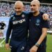 An image of Enzo Maresca, manager of Chelsea, and Pep Guardiola, manager of Man City embracing on the pitch.