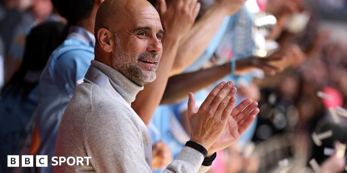 Manager Pep Guardiola applauds as his Manchester City players lift the FA Cup trophy after beating Chelsea in the 2026 final