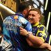 Luke Littler (right) embraces Luke Humphries after victory in the final on night thirteen of the BetMGM Premier League 2026 at P&J Live, Aberdeen.
