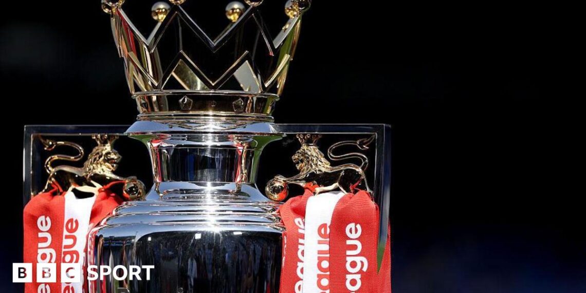 The Premier League trophy, adorned with red and white ribbons for champions Arsenal, sits pitchside at Selhurst Park beforer the end of season presentation and celebrations