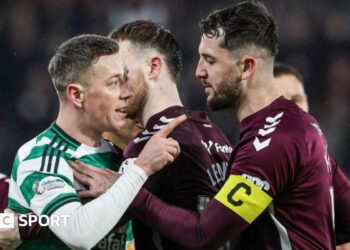 Celtic's Callum McGregor clashes with Hearts' Blair Spittal (not in frame) during a William Hill Premiership match between Heart of Midlothian and Celtic at Tynecastle Park, on January 25, 2026, in Edinburgh, Scotland.