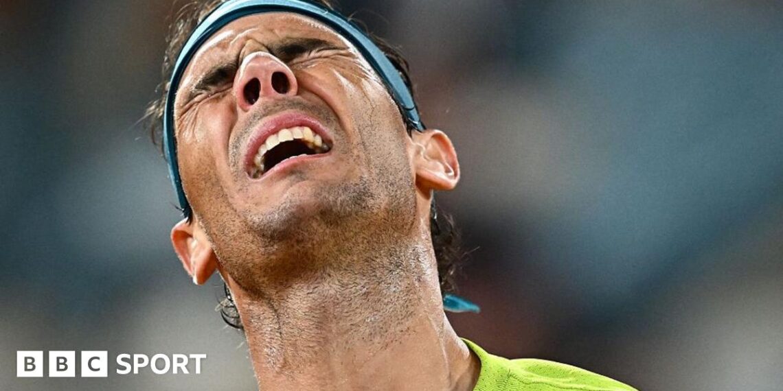 Rafael Nadal winces in pain.