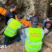 Rescuers race to free seven people trapped in flooded Laos cave