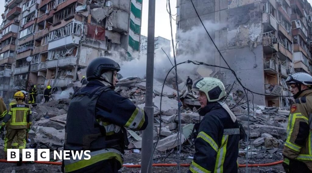 Rescuers search rubble of Kyiv flats after massive Russian strikes kill two