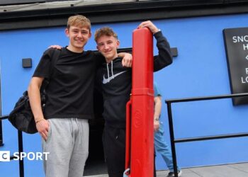 Two players pose for a picture outside the Norther Snooker Centre in Leeds