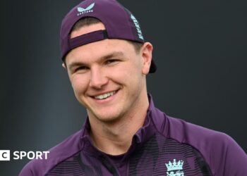 Sonny Baker, wearing a cap, smiles during England training