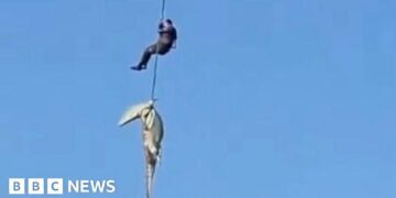 South African police officer lowered into crocodile-infested river to recover human remains