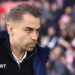 Southampton manager Tonda Eckert in blue coat and black zip-up top
