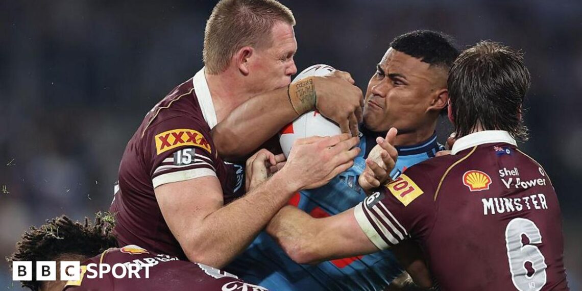 Haumole Olakau'atu of New South Wales is tackled during the game
