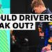 Max Verstappen dressed in Red Bull race suit with a hand to his head