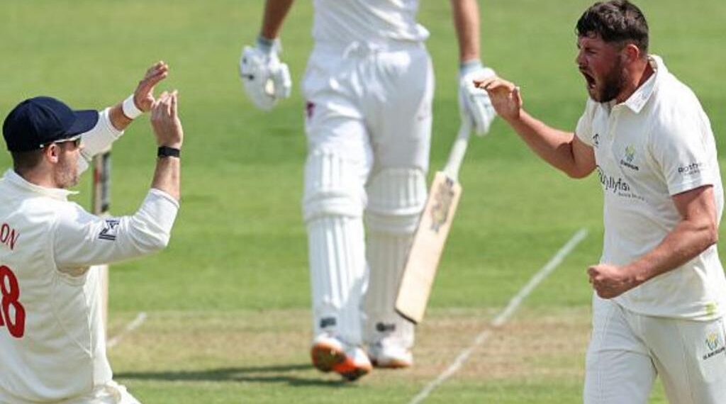 Tom Norton (R) celebrates