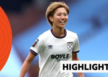 Riko Ueki celebrates goal, smiling and wearing a white West Ham shirt