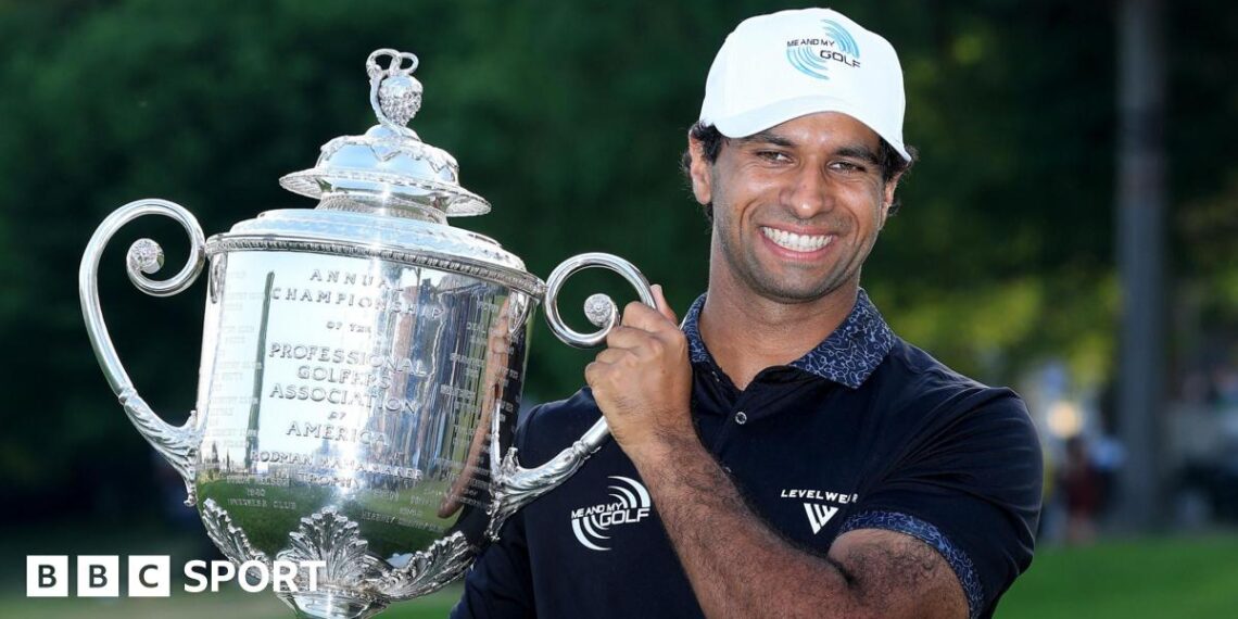 Aaron Rai lifts the Wanamaker Trophy