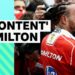 Lewis Hamilton smiling in Ferrari race suit