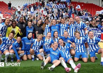 The players of Brighton & Hove Albion pose for a photo after the team's victory in the Adobe Women's FA Cup Semi Final match between Liverpool and Brighton