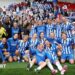 The players of Brighton & Hove Albion pose for a photo after the team's victory in the Adobe Women's FA Cup Semi Final match between Liverpool and Brighton