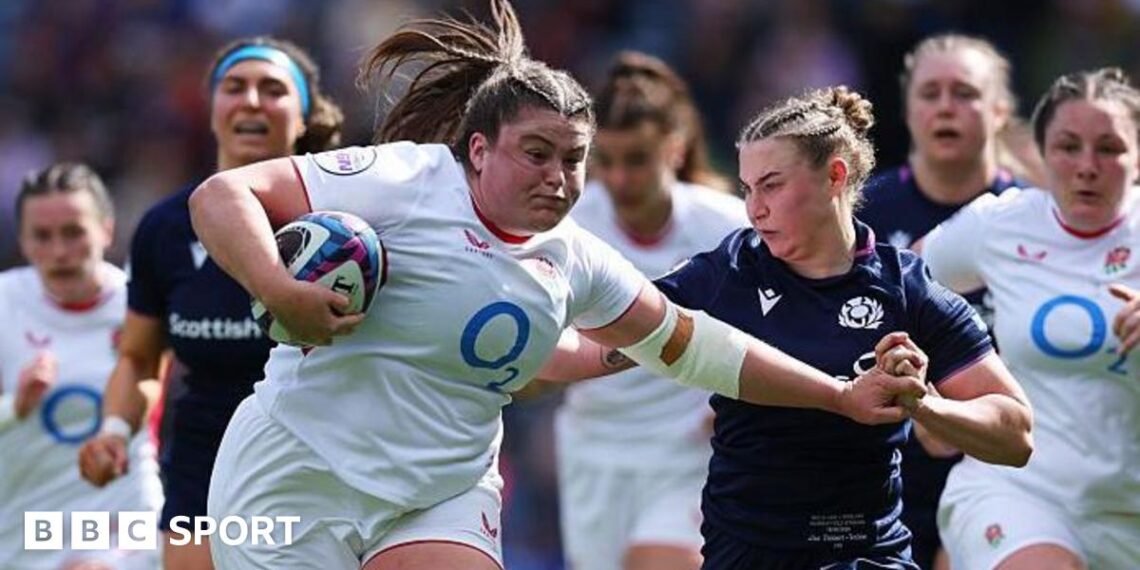 Maud Muir carries the ball