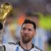 Lionel Messi holding the World Cup trophy
