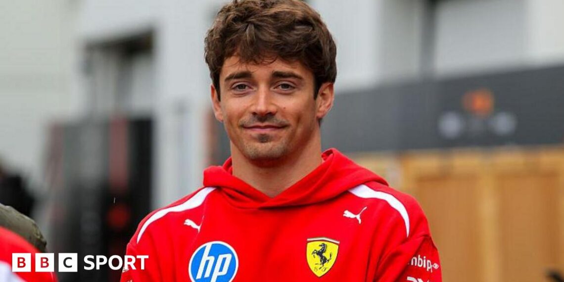 Charles Leclerc poses in the paddock ahead of the Canadian Grand Prix