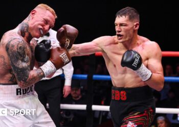 Chris Billam-Smith and Ryan Rozicki trade blows in the ring