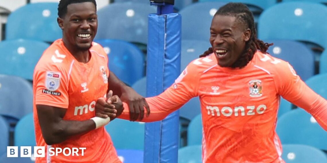 Ephron Mason-Clark (left) and Brandon Thomas-Asante (right), both wearing Coventry City's bright orange away strip, give each other five while celebrating a goal at Sheffield Wednesday in October